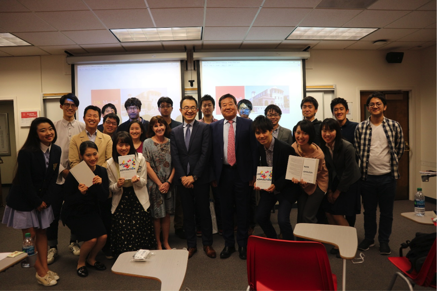 Group photo of Japanese student presenters with Professor Park, Professor MacInnis, and MBA candidates